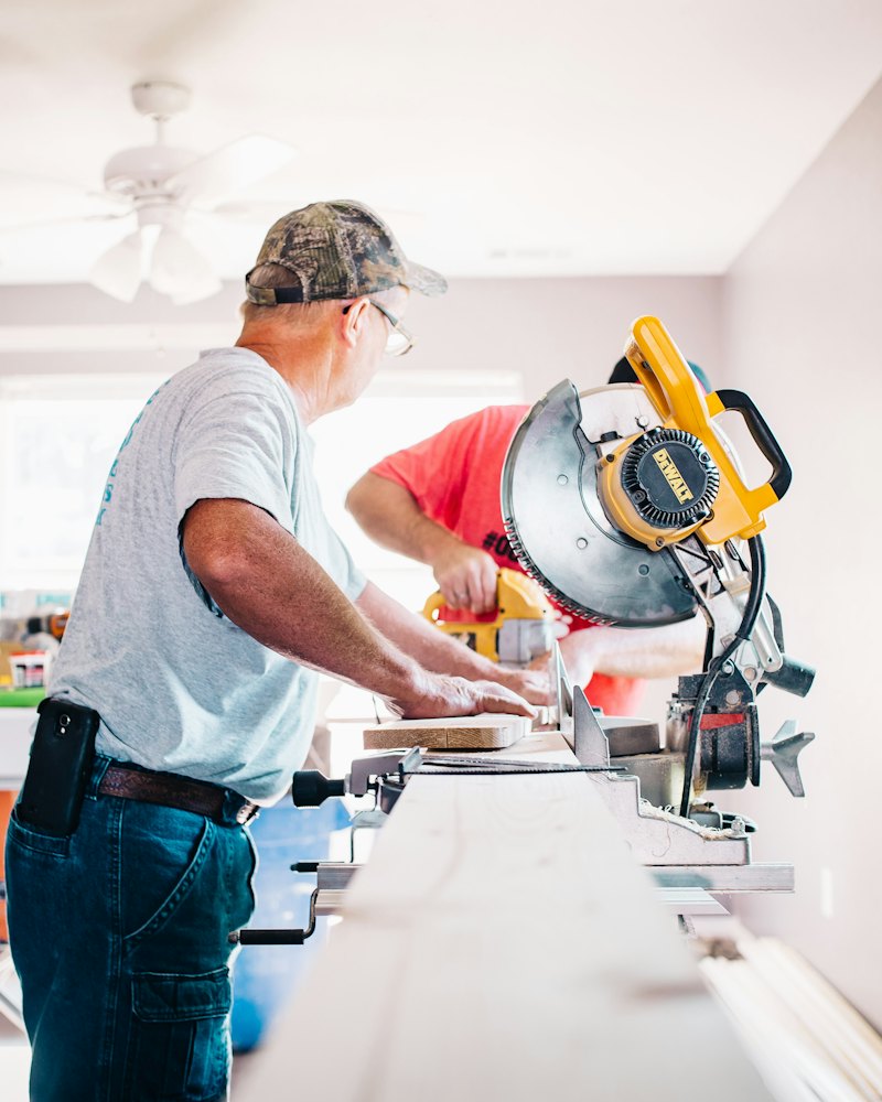 Handyman at work with a miter saw